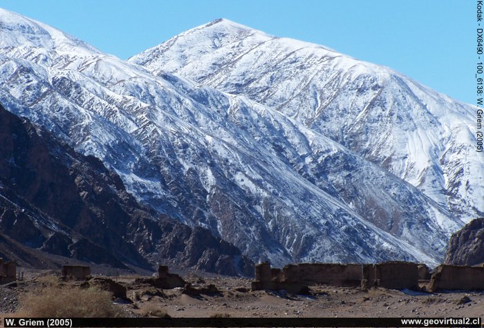 The Ruins of Puquios with the snow-capped mountains of the Atacama Desert.