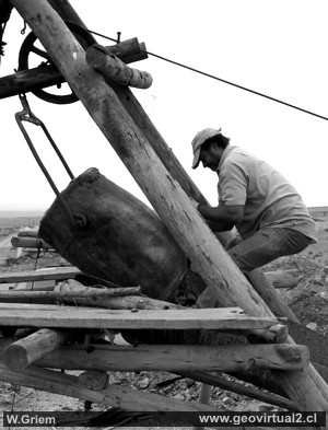 Discharging the ore, miner in a small scale mine near Copiapó